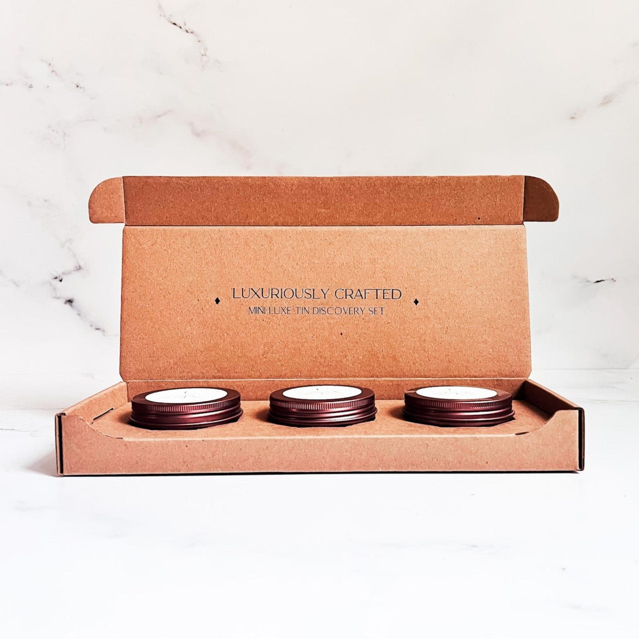 Mini Luxe Discovery Candle Set.  Choose 3 scents in a 3 oz mini candle tin. 