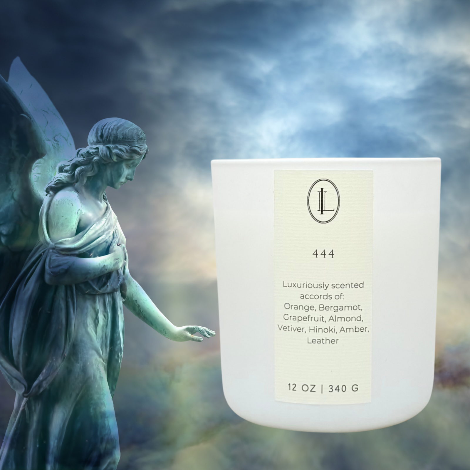 white candle with a label that reads 444 with angel statue in the background