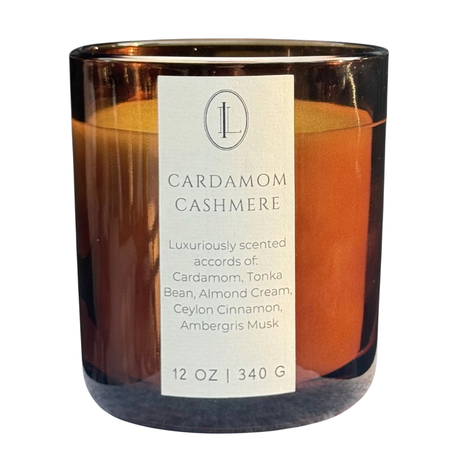 Woodwick Candle labeled 'Cardamom Cashmere' with a visible Luxe Intuition logo in an amber vessel on a white background