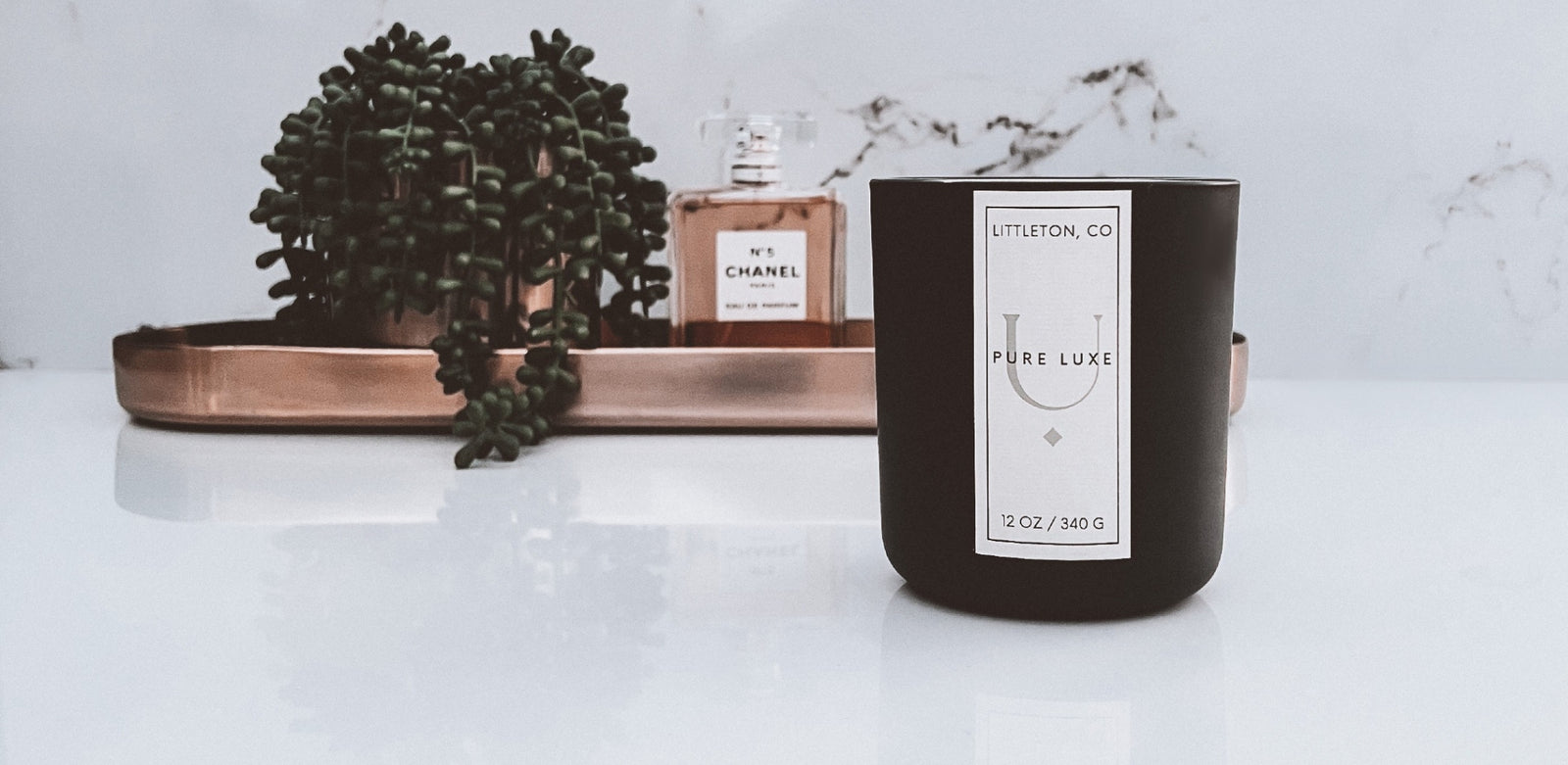 Pure Luxe wooden Wick Candle in a matte black vessel 12 oz