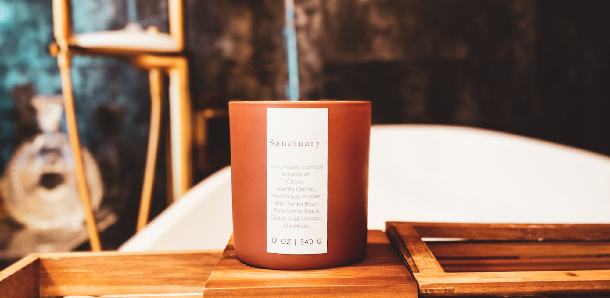 Sanctuary Wooden Wick Candle in a matte terra cotta color vessel