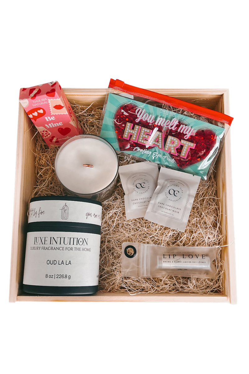image of opened luxe love box with items showing in a wood box.
