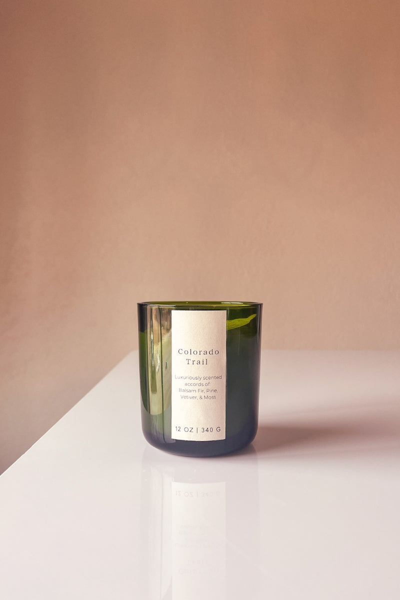Colorado Trail Wooden Wick Candle, an earthy and mossy scented candle with vetiver and pine.